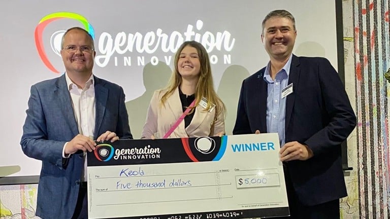 Josie Pacey, winner of the 2022 generation innovation challenge with Youi's COO Peter Broome