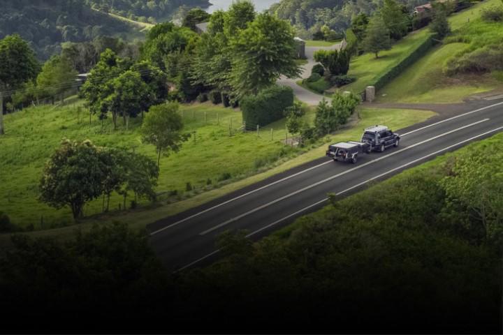 4WD towing trailer on rural road