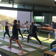 A group of Youi employees doing yoga.