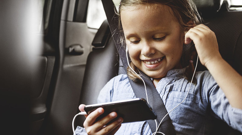 Child listening to mobile phone
