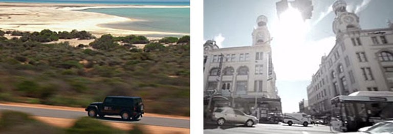 Jeep driving down a motorway near the ocean and a busy town