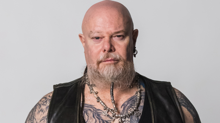 Image of David looking straight faced.