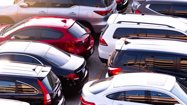 A group of vehicles in a carpark