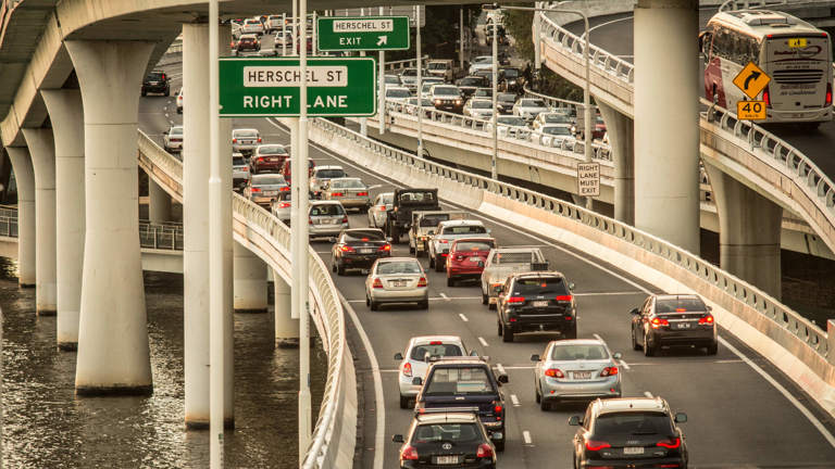 Cars driving on a road in Brisbane.