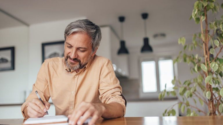 A man working through his fire safety checklist
