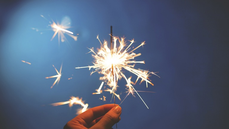 Hand holding a sparkler