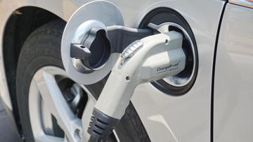 Hybrid car being recharged