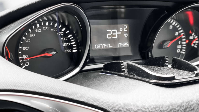 Image of car instrument panel showing speedometer