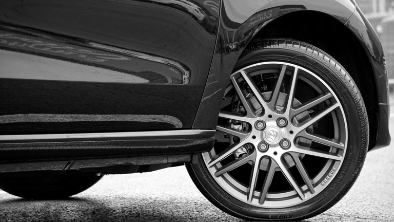 Black and white close up of a car tyre