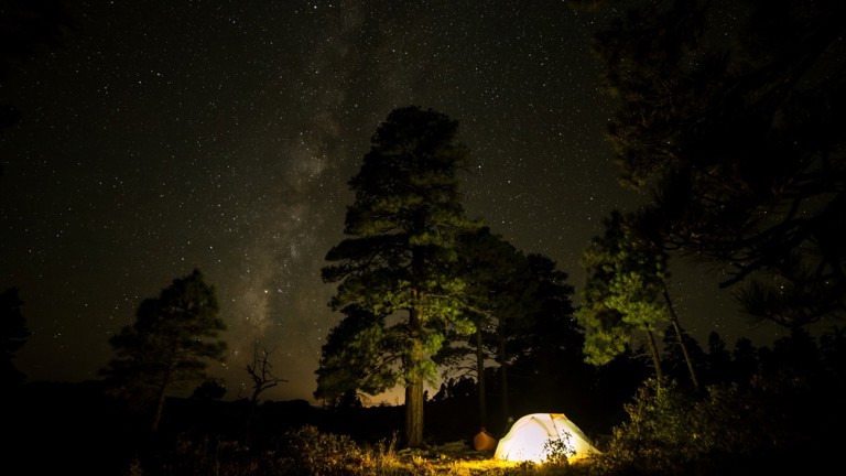 A tent lit up at night