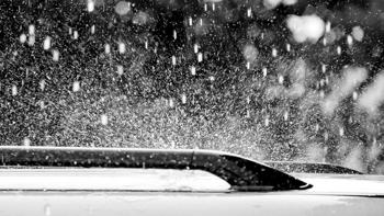 Hail falling on the roof of a car. 